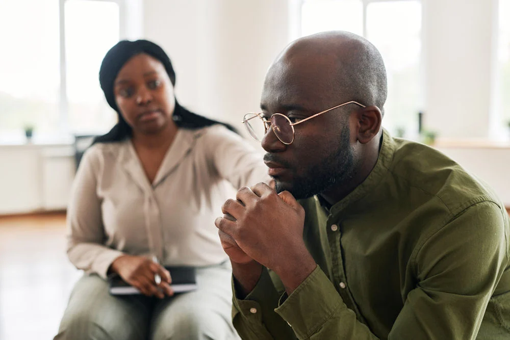 a-man-being-comforted-in-cbt-for-alcohol-use-disorder