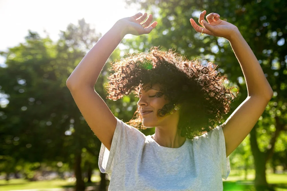 sober-4th-of-july-celebration happy woman celebrating outdoors