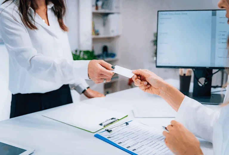 woman receiving insurance tab showing quest insurance coverage details.