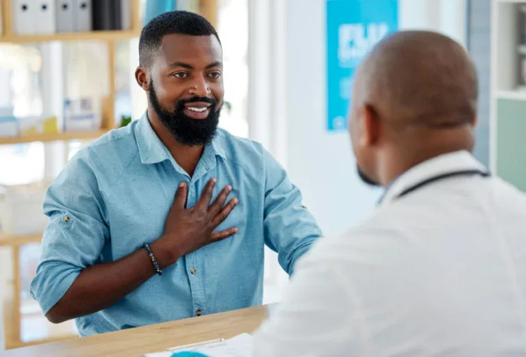 man talking with doctor about quest insurance coverage for treatment options.