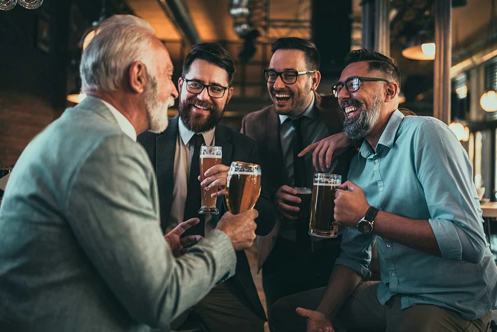 men-laughing-and-drinking-alcohol