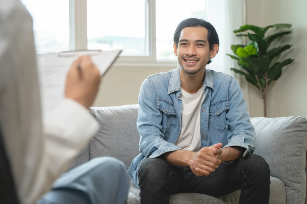 a man smiling at his therapist