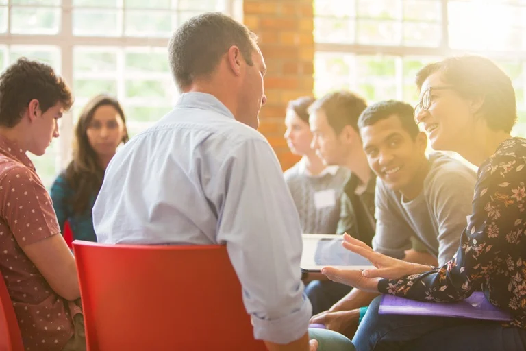Group therapy discussing helpful tips to stop drinking