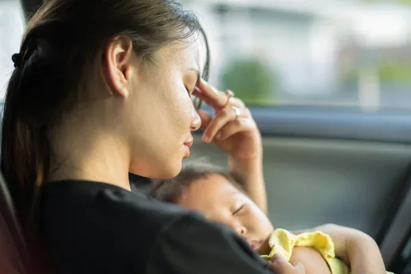 a mother who is experiencing postpartum depression