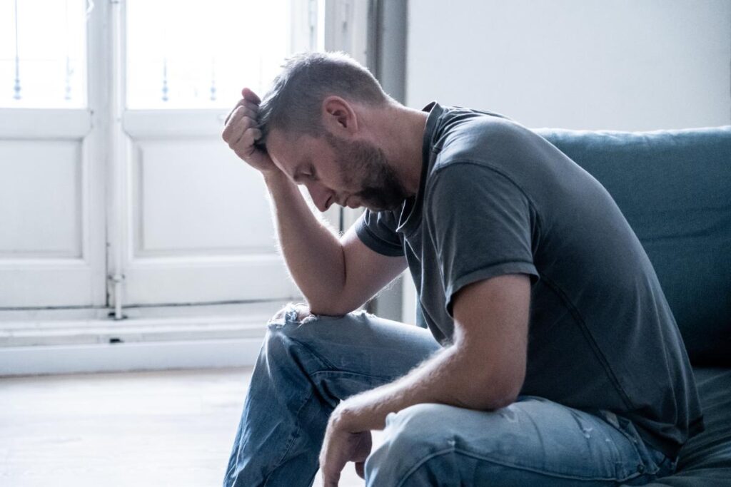 A person showing the physical side effects of detoxing