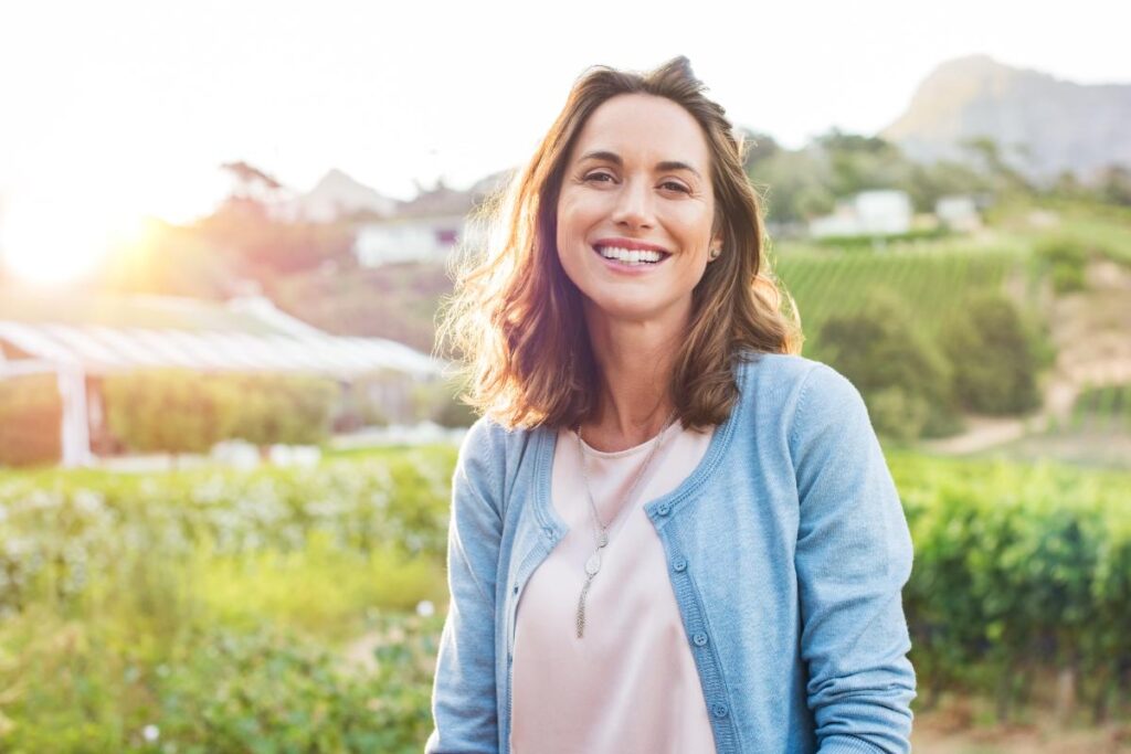 Smiling woman learning three key benefits of cognitive-behavioral therapy