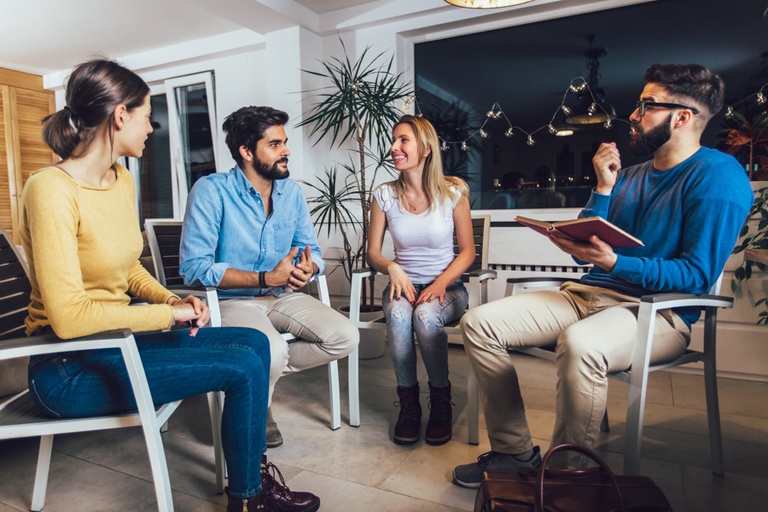 A group therapy session discussing three reasons to start the New Year sober for health and growth