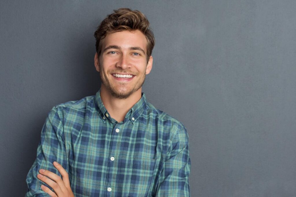 young man smiling after successfully searching for a rehab for men near cumberland pa