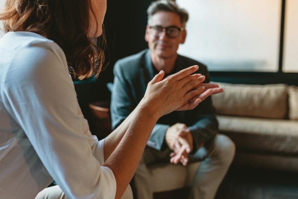 female therapist answering male client's question how long does dbt therapy last