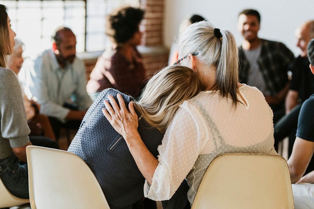 people in a circle at group therapy in a php, learning what is partial hospitalization program