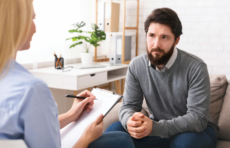 A man and his therapist in a men’s rehab center and treatment near Windsor Park, PA