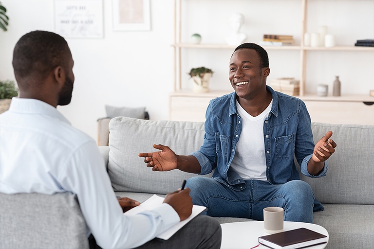 Happy patient learning three benefits of a detox program