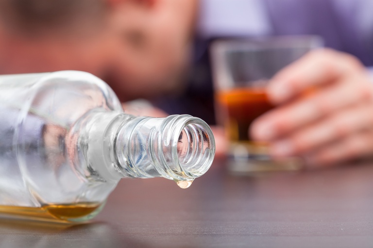 Alcohol withdrawal symptoms including nausea, anxiety, tremors