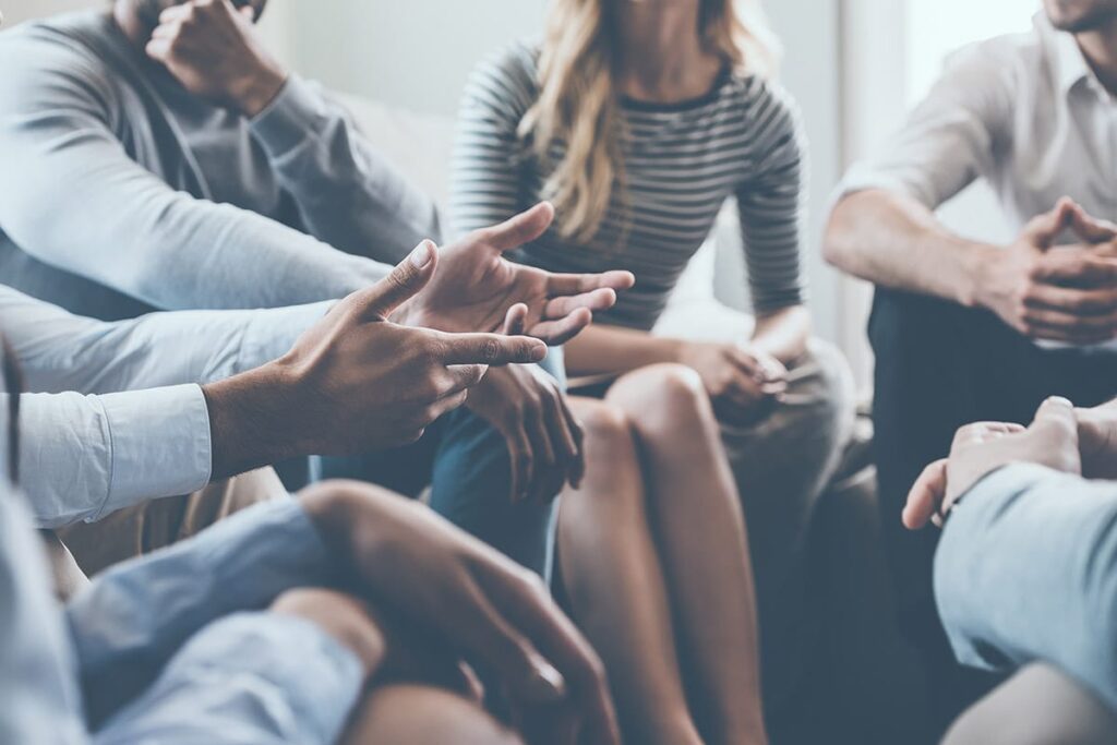 people talk in a circle in residential treatment near State Collegepa
