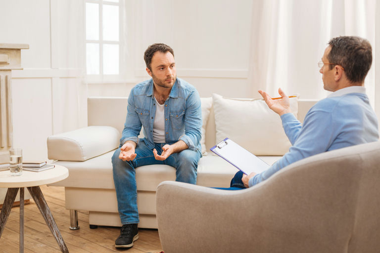 A therapist explaining residential addiction treatment options near Wilkes-Barre, PA