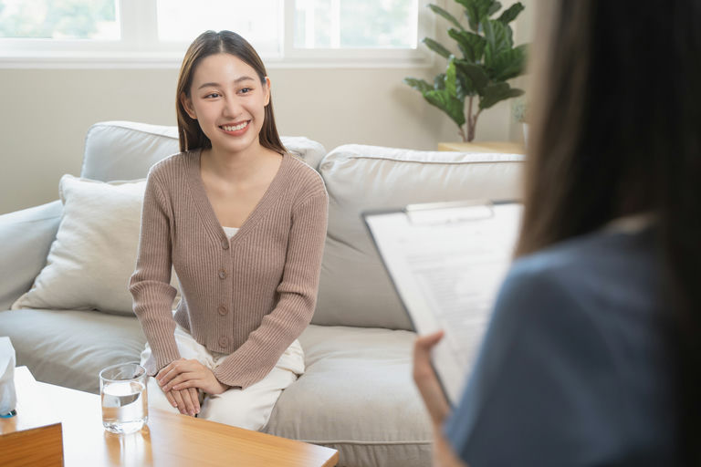 A woman happy to find residential addiction treatment and support near Pottsville, PA