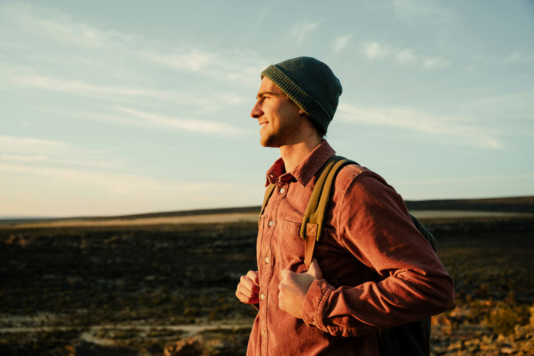 Man enjoying outdoor activities, such as hiking and nature walks, to support mood and combat depression