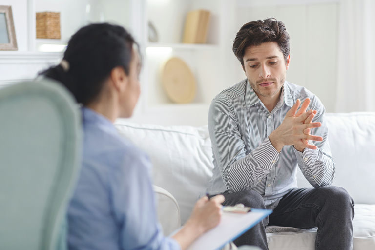 An addicted man seeking help through IOP outpatient addiction treatment available near Harrisburg, PA