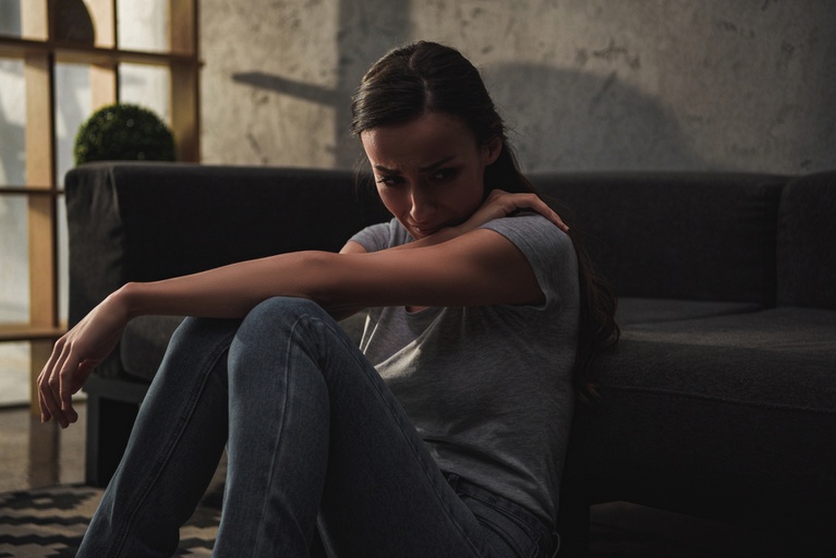 Woman showing common signs of opioid withdrawal symptoms