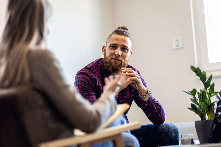 A man listening to his therapist about addiction treatment options for veterans in Pennsylvania