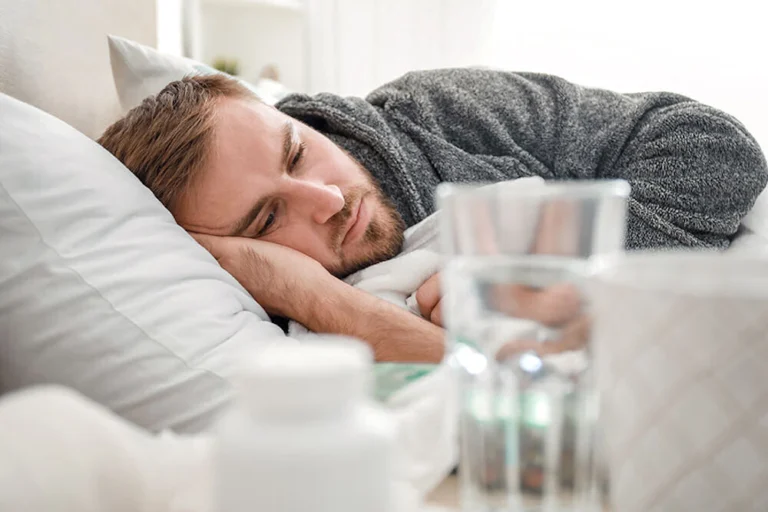 Man in bed managing alcohol withdrawal safely with benzodiazepines