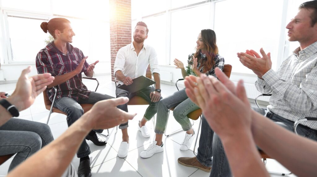 People in a group therapy session enjoying a sober Fourth of July celebration