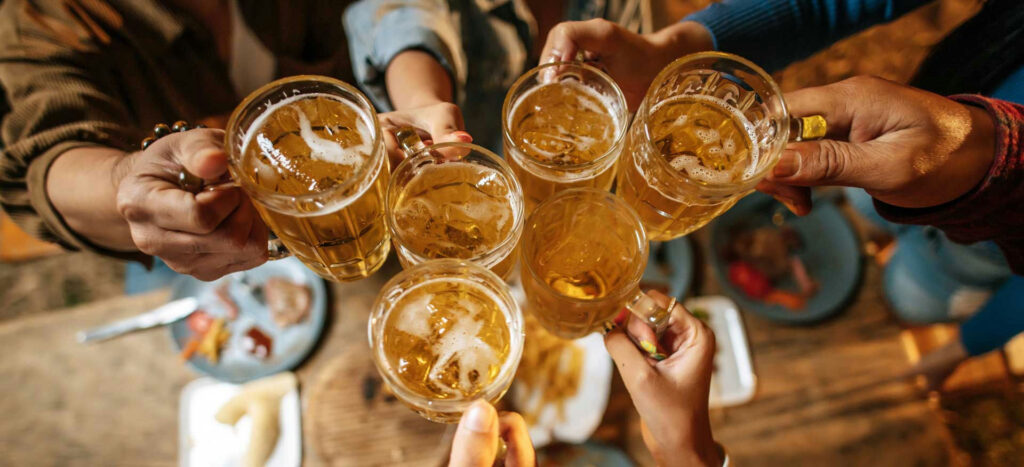 a-group-of-friends-cheering-with-beer