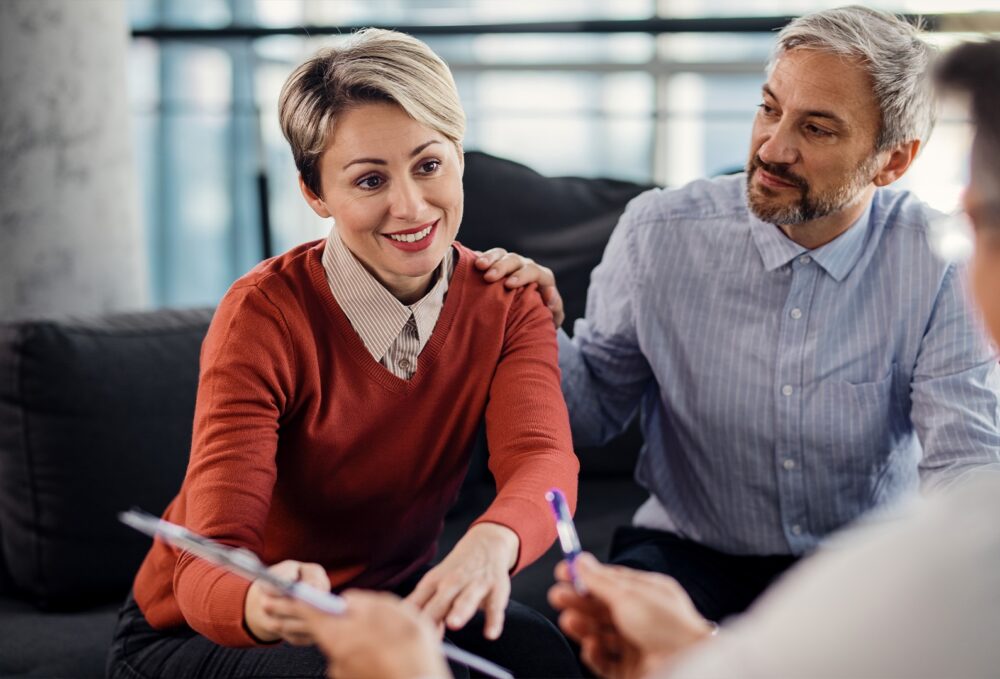 a woman about to sign paperwork