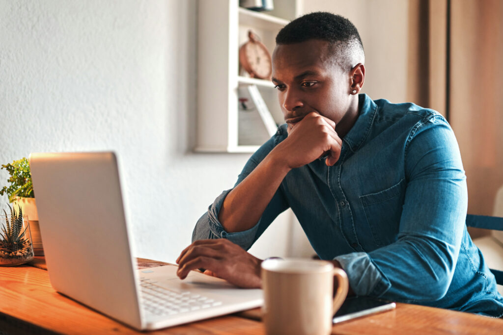 a man on laptop doing research